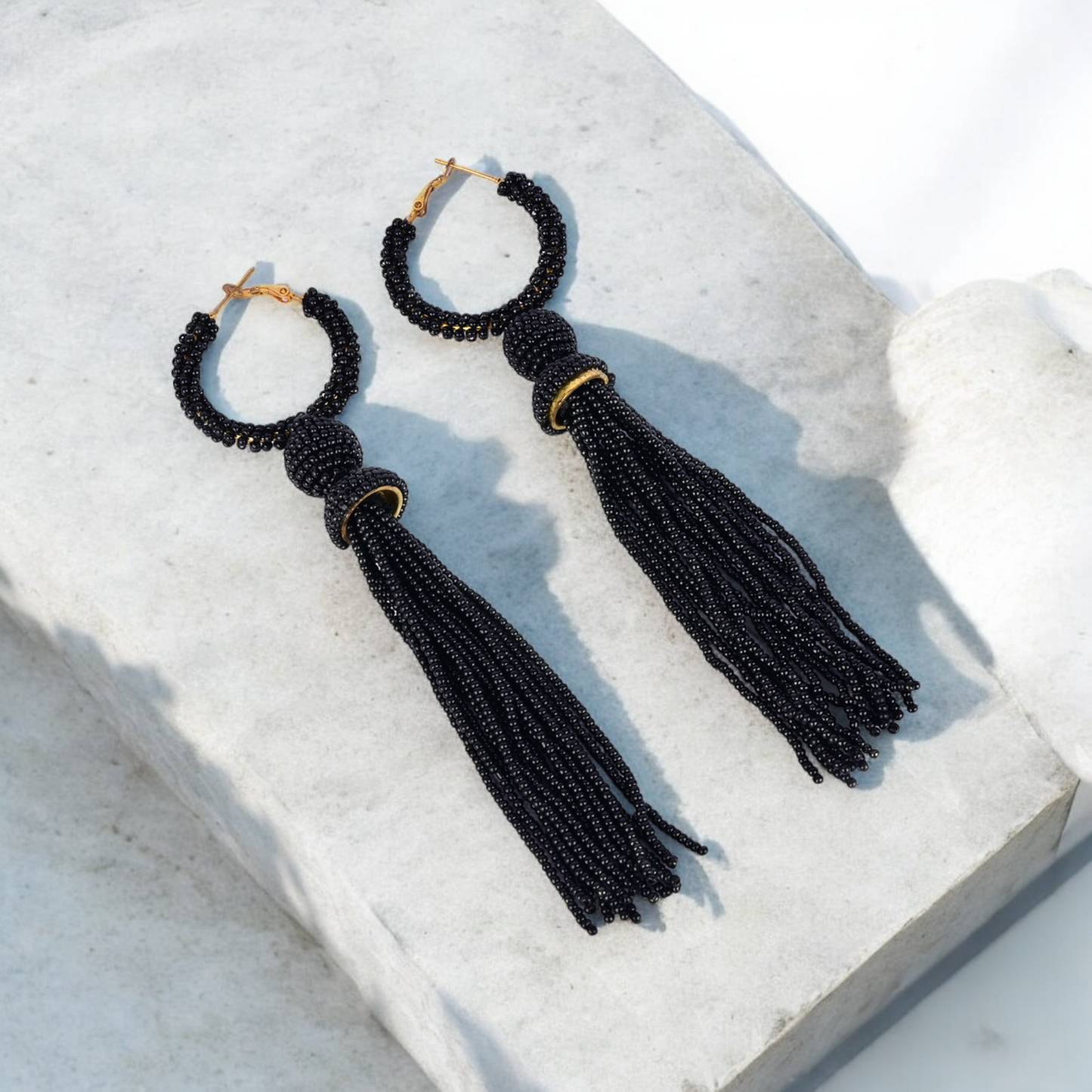 Elegant Black Beaded Hoop Earrings with Tassel Detail