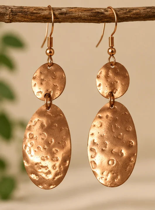 Hammered copper oval drop earrings close-up