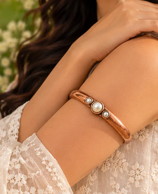 Pure copper armlet with pearl beads worn on the wrist