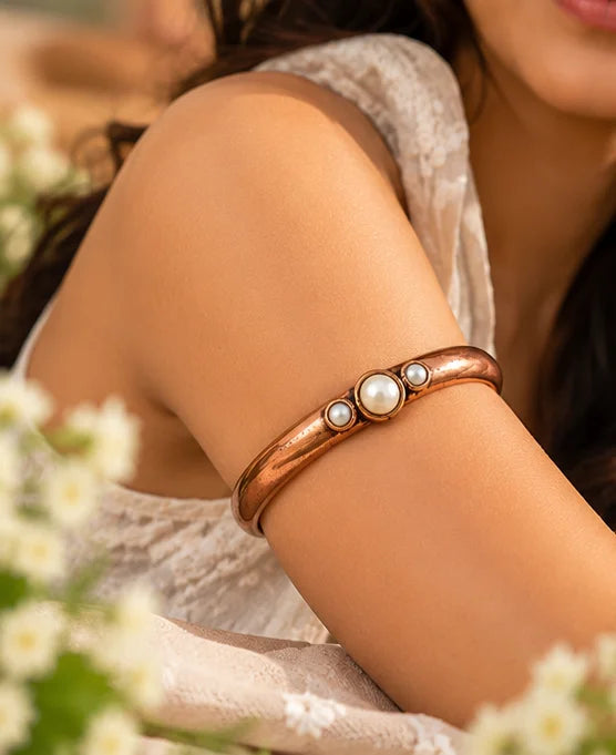 Pure copper armlet with pearl beads detailing close-up