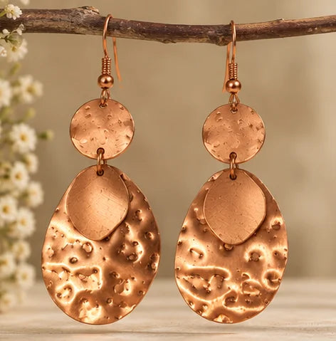 Hammered copper drop earrings with textured oval design