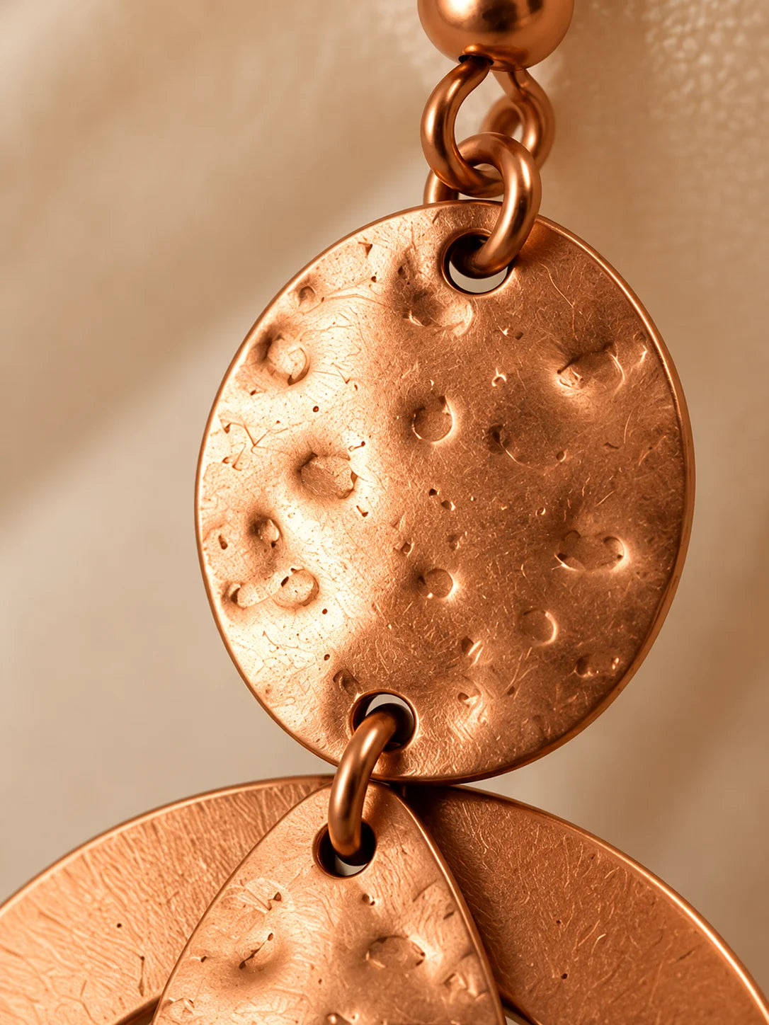Handmade copper drop earrings close-up product view