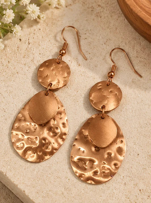 Textured oval hammered copper drop earrings close-up