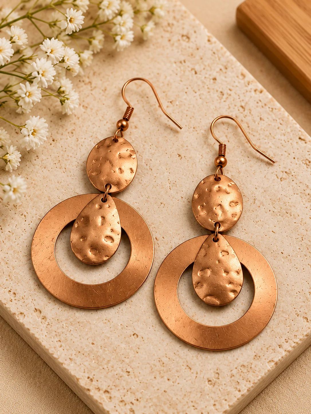 Handmade copper drop earrings for women worn with an elegant outfit